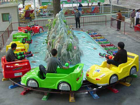 Kids And Family Use Small Roller Coaster For Amusement